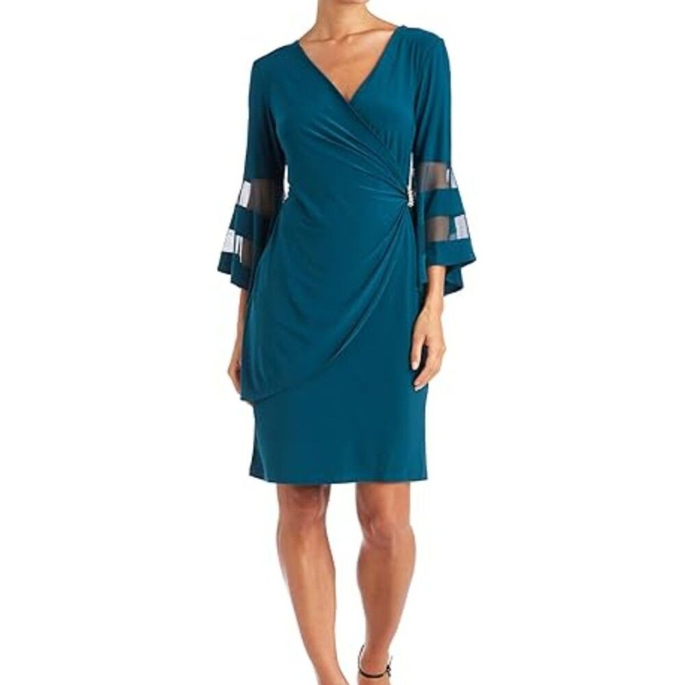 Wrap dress with sheer sleeves and rhinestone accent